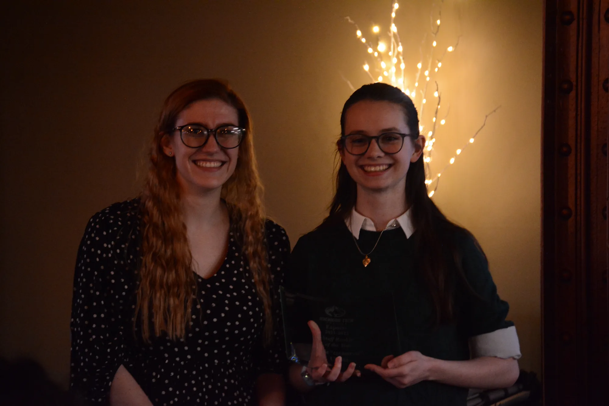 Katie and Katy at the Esports banquet, Kaite holding an award